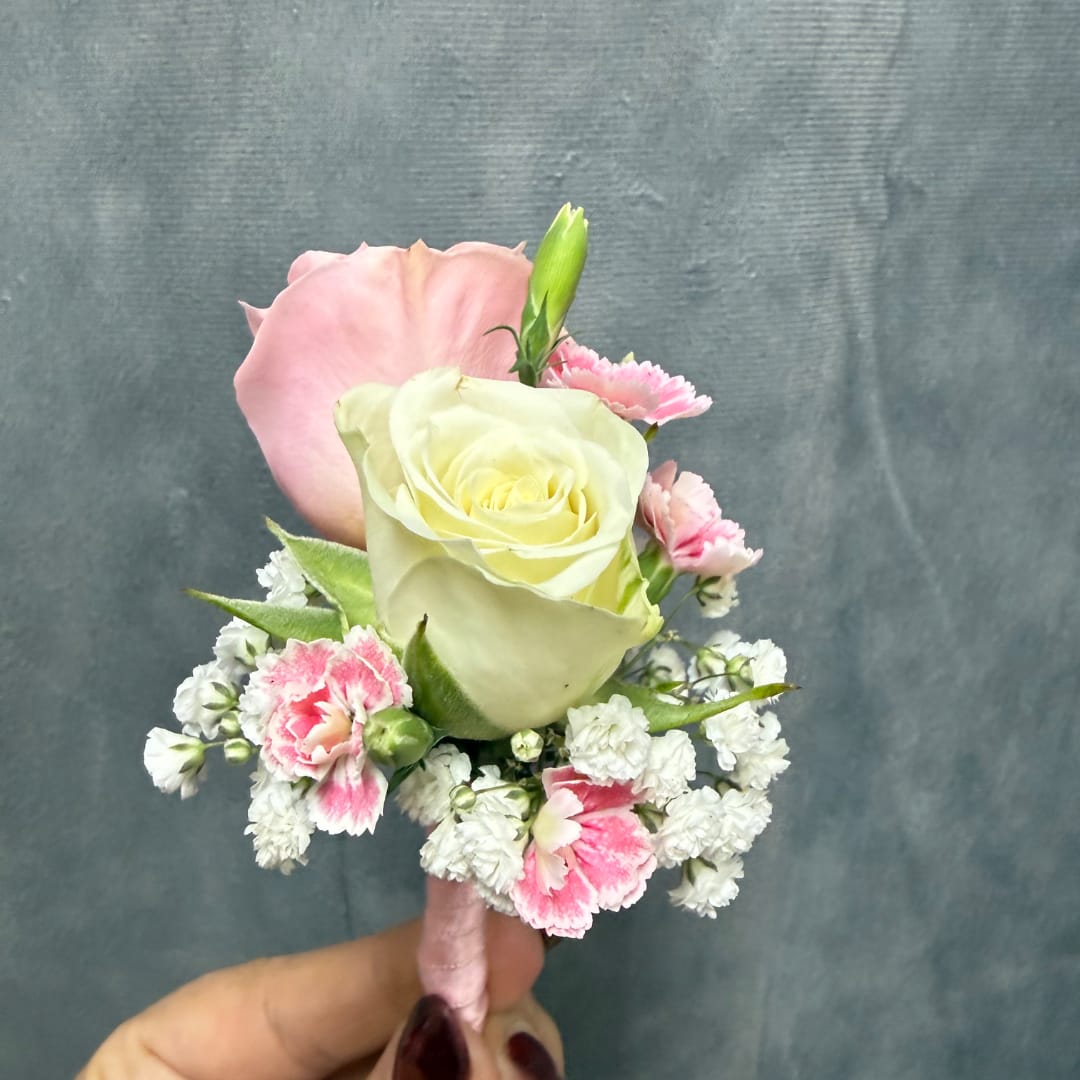 Small hand-tied bouquet with pink and white roses and carnations