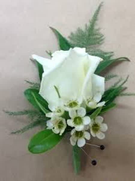 White calla lily boutonniere with small white accent flowers