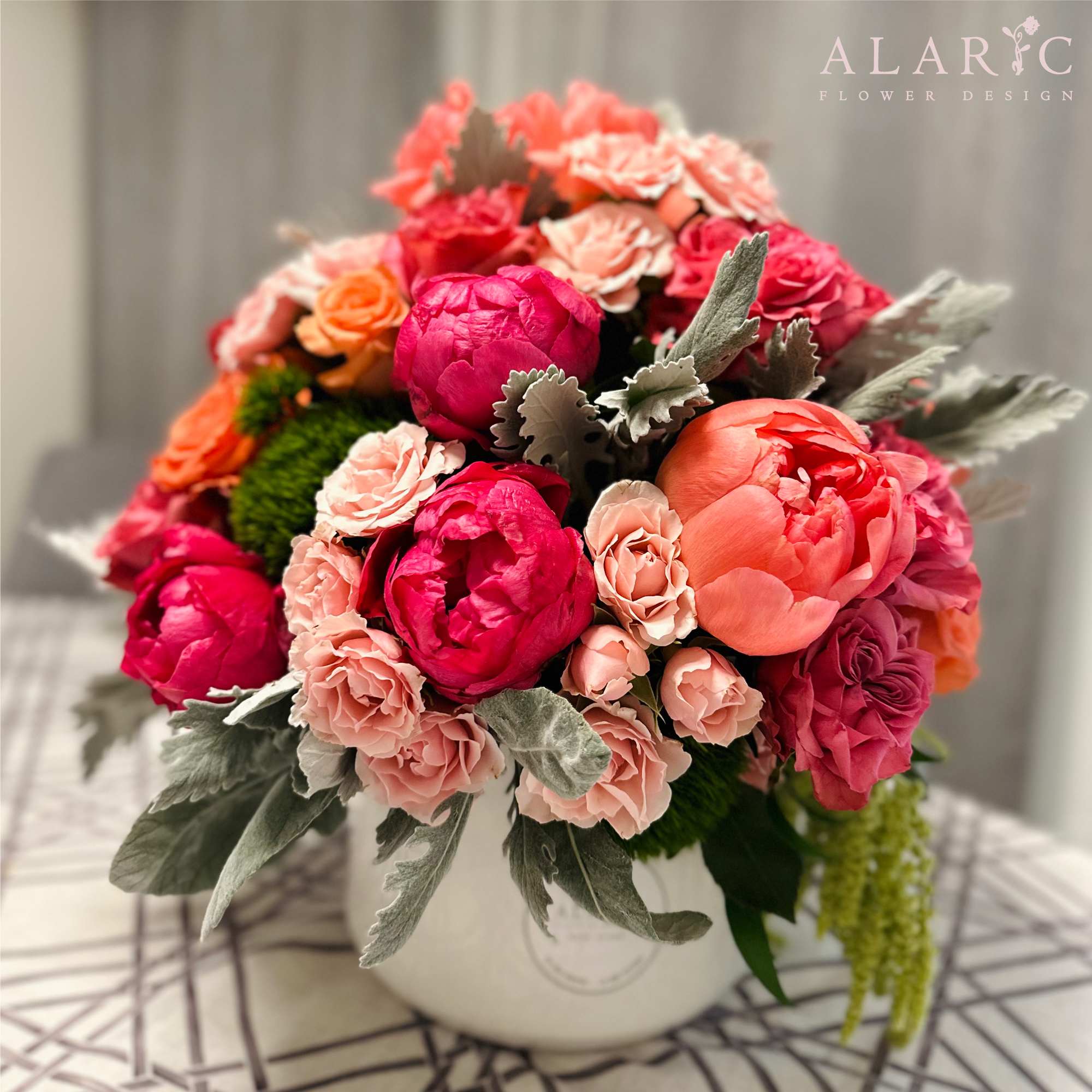 Pretty in Pink - Gift this arrangement of peonies mixed with roses in a ceramic pot to someone you care about! It could be a perfect gift for many occasions such a baby shower, a birthday, an anniversary and more!  Note: Pot may vary.