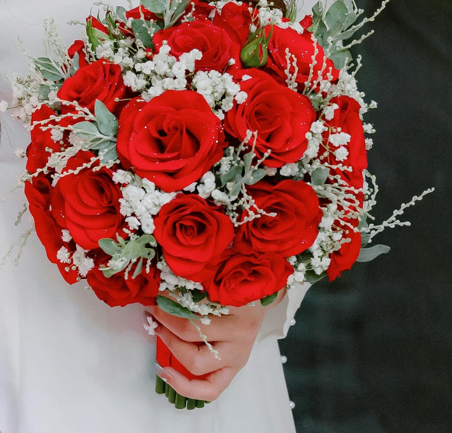 Red Rose Bouquet - A hand-tied bouquet featuring classic red roses and baby's breath complemented with a beautiful ribbon. Perfect for formal events like proms, weddings, and debutante balls.