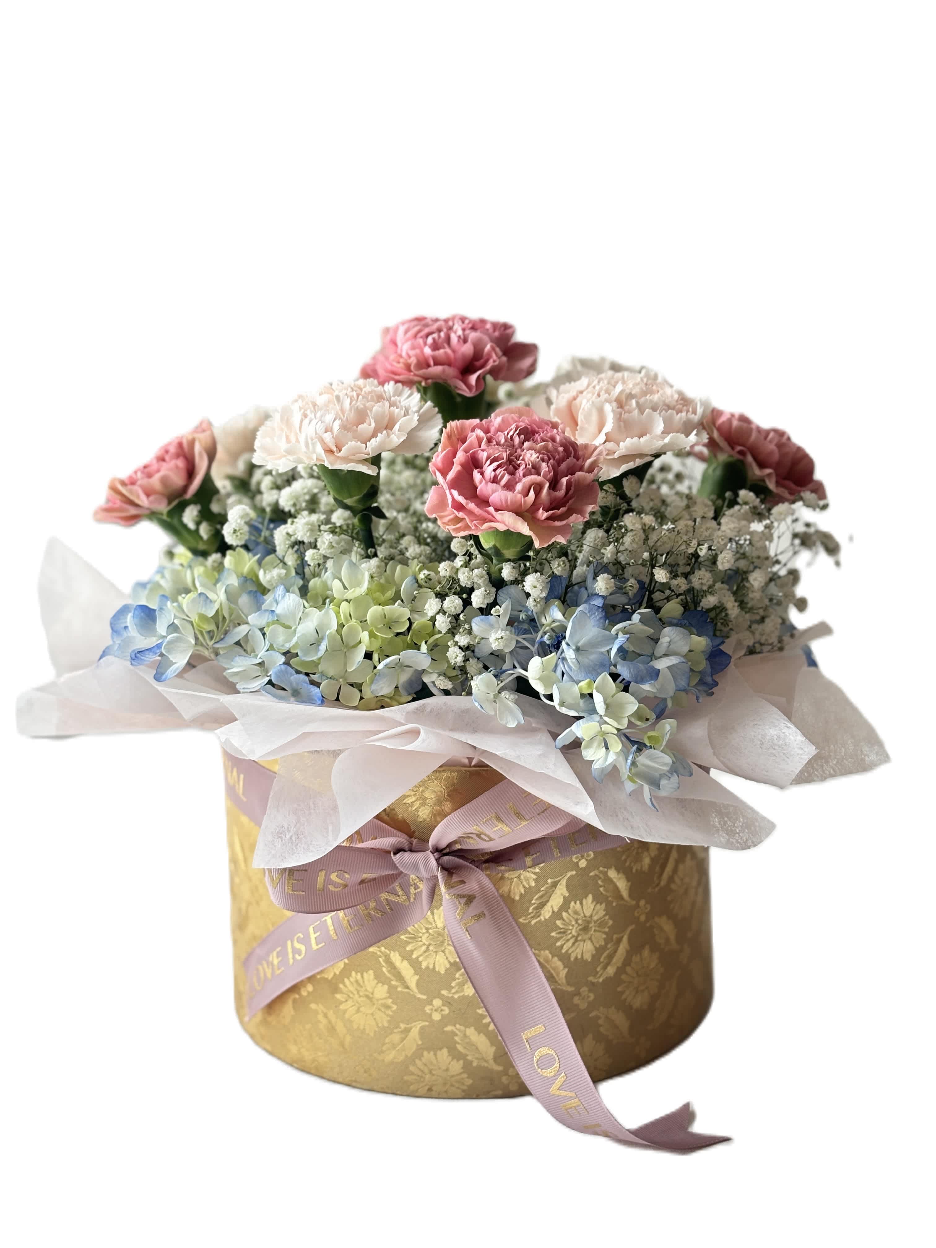 Pink and white carnations with blue hydrangeas in a gold hatbox