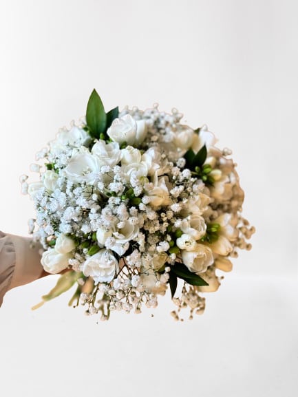 White bouquet with baby's breath and green accents