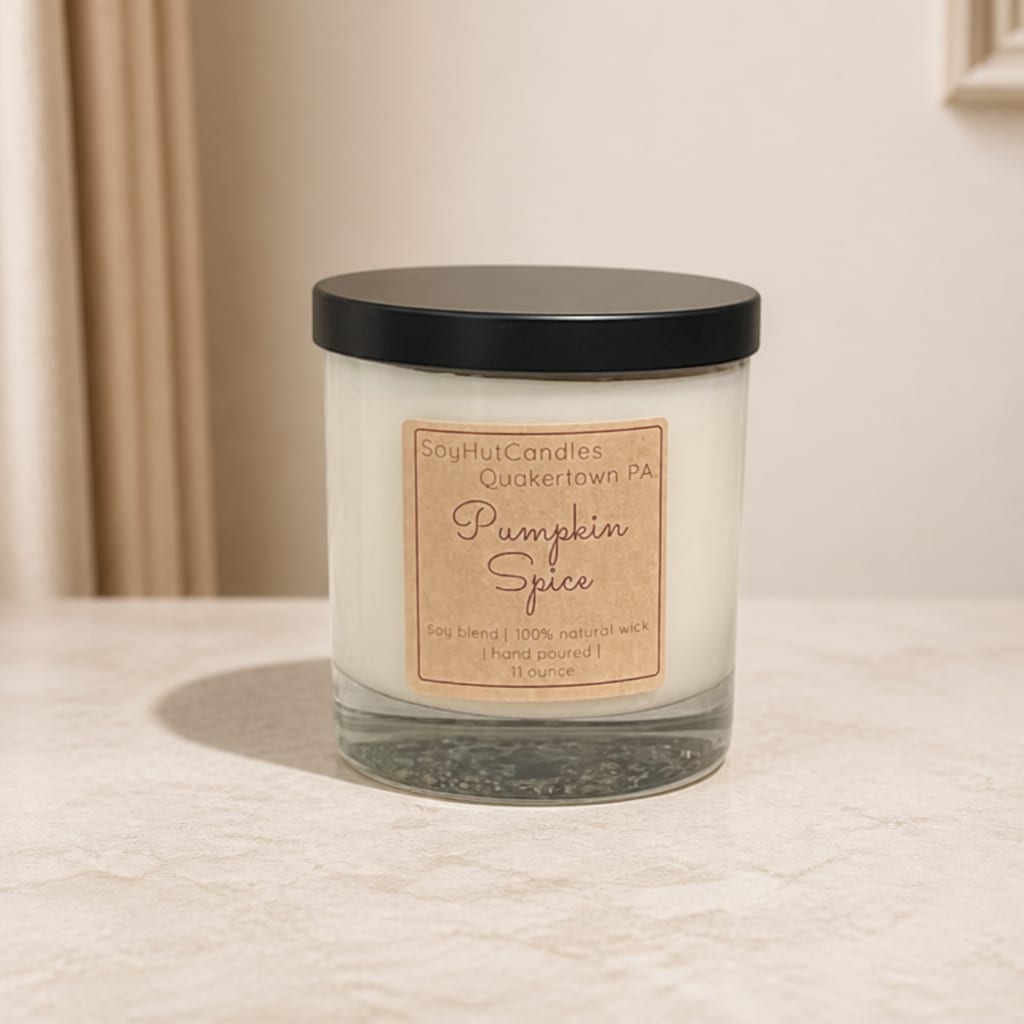 Pumpkin Spice candle in a glass jar with a black lid