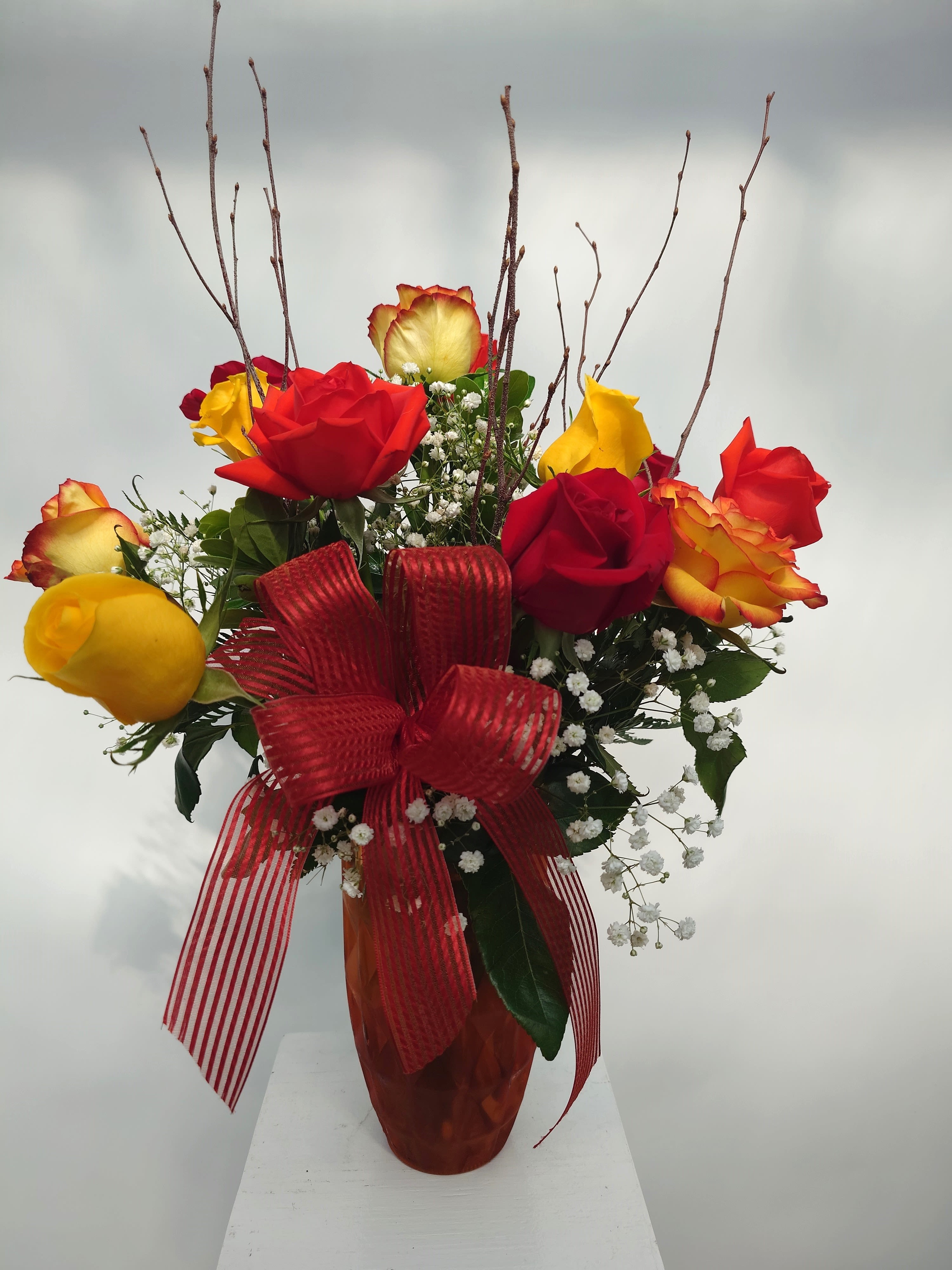 Dozen Fall Roses - A dozen roses inspired by the Fall season. We do same day delivery to all romantic locations in the Ithaca area.
