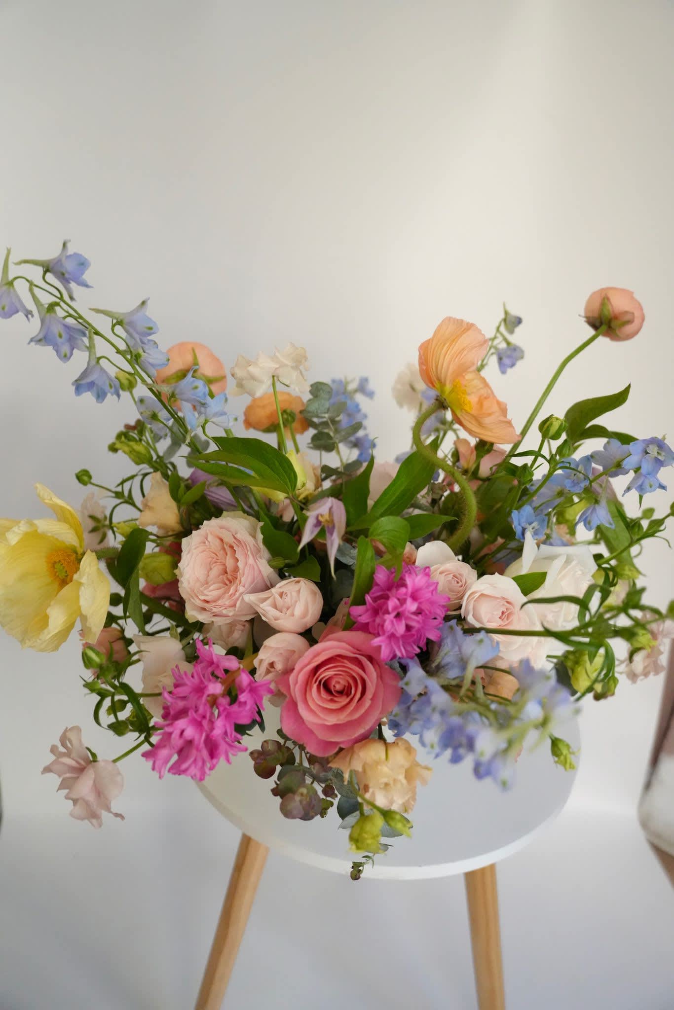 Mixed pastel bouquet in a white vase