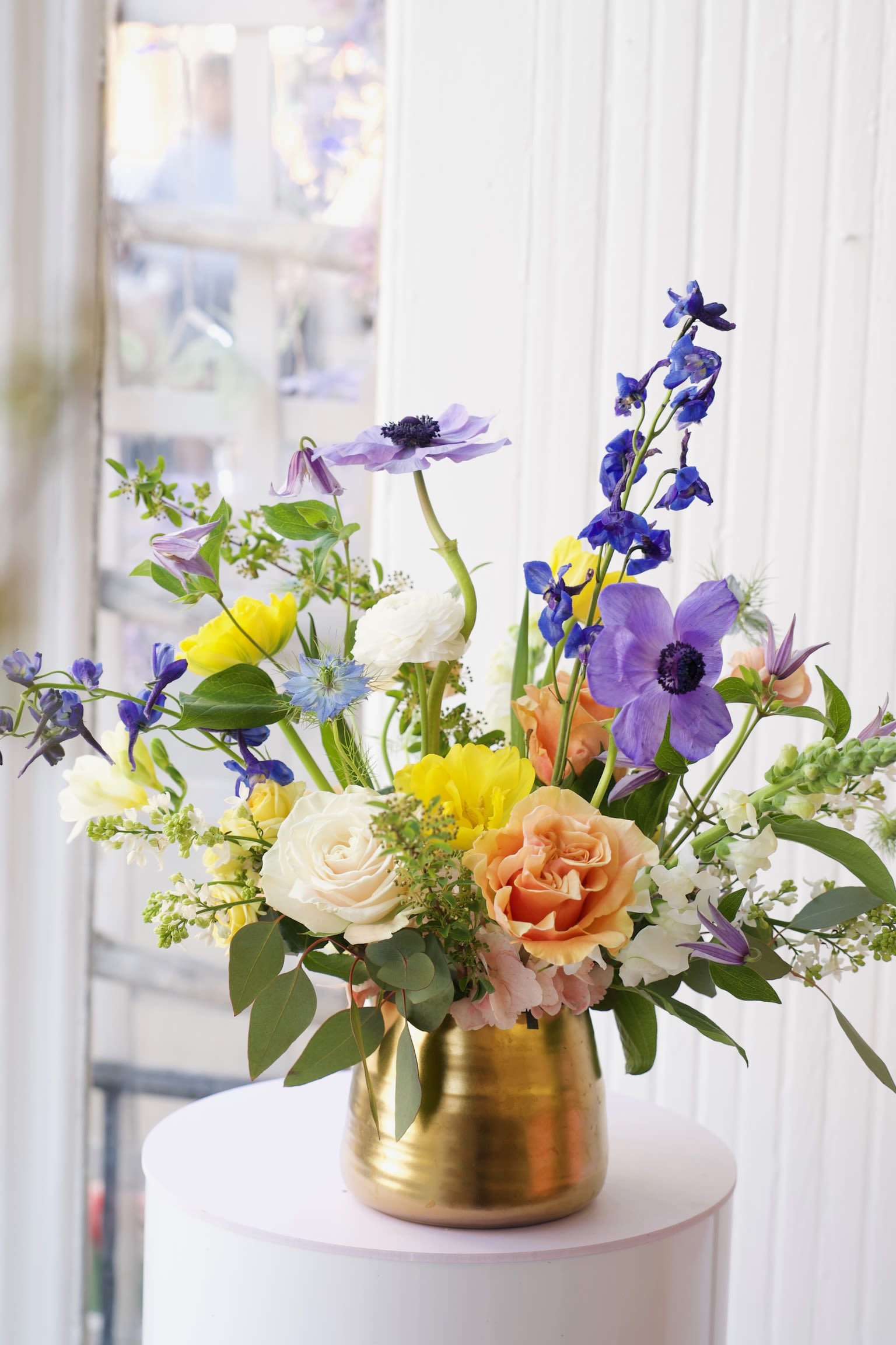 Fleur Mirage - A dreamy blend of delphinium, anemones, roses, and ranunculus—soft hues and bright tones that feel like a floral illusion at sunset.