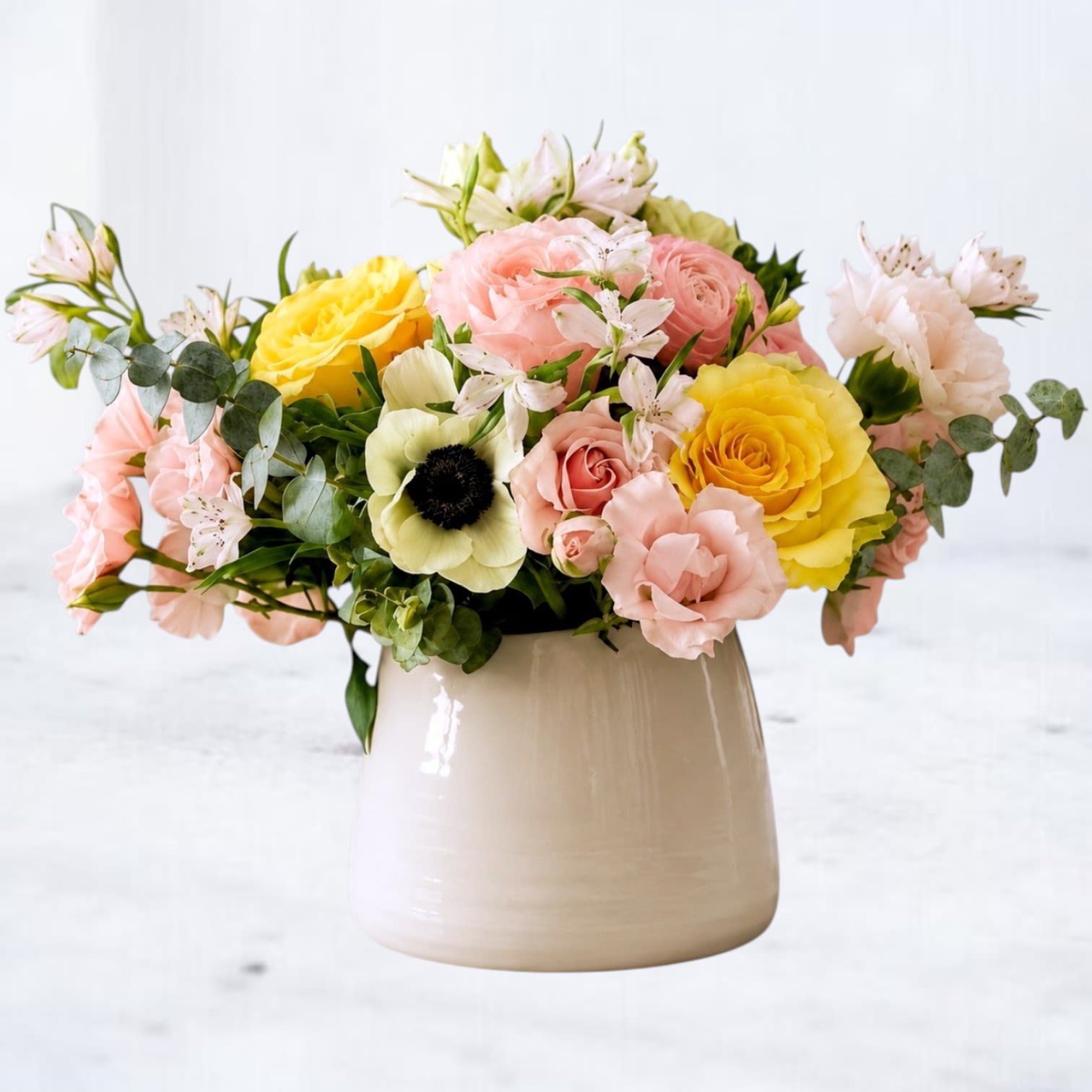 Sherbet - Sherbet is a vibrant floral design bursting with cheerful color and fresh seasonal texture. Featuring sunny yellow roses, soft blush blooms, delicate accent flowers, and lush greenery, this arrangement captures the carefree feeling of a warm summer afternoon.  Designed in a modern ceramic vessel, Sherbet offers a playful mix of sunshine yellow, soft pink, creamy white, and fresh green tones that make it suitable for birthdays, thank you gifts, celebrations, get well wishes, new baby occasions, or simply brightening someone's day.  Handcrafted with premium seasonal flowers, each arrangement is designed with natural movement and garden-inspired charm. Flower varieties may vary slightly based on seasonal availability while maintaining the overall color palette and style.  Available for same-day flower delivery throughout Montgomery, Magnolia, The Woodlands, Conroe, Spring, Tomball, Houston, and surrounding Texas communities.