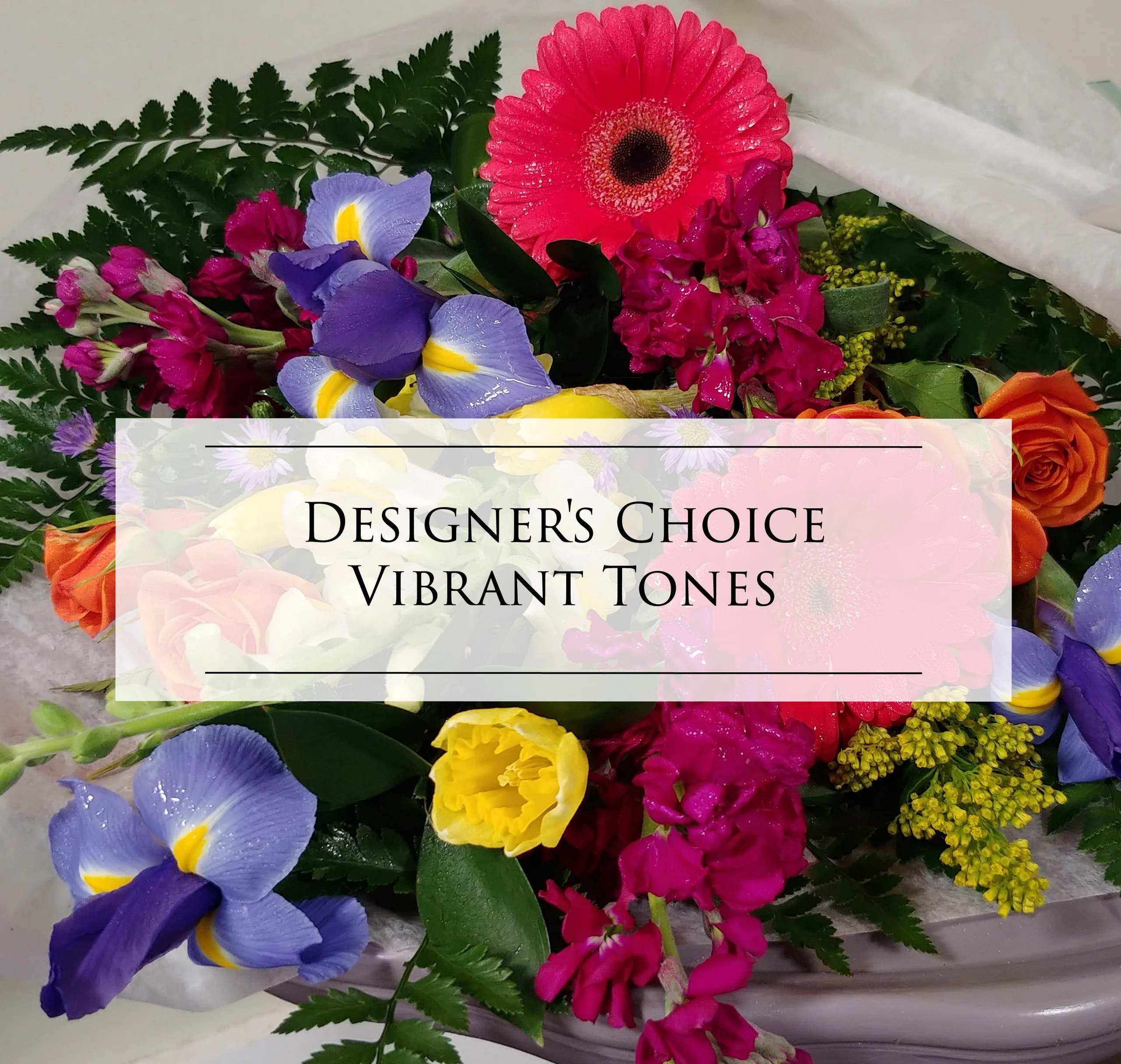 Vibrant mixed bouquet with gerbera, roses, iris, and yellow blooms