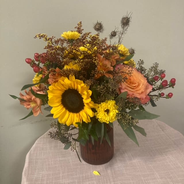 Autumn whispers - A lovely autumnal mixture of blooms.   Please Note: Each design is custom made and filled to value. We only use fresh product to ensure top quality so new orders are subject to substitutions.