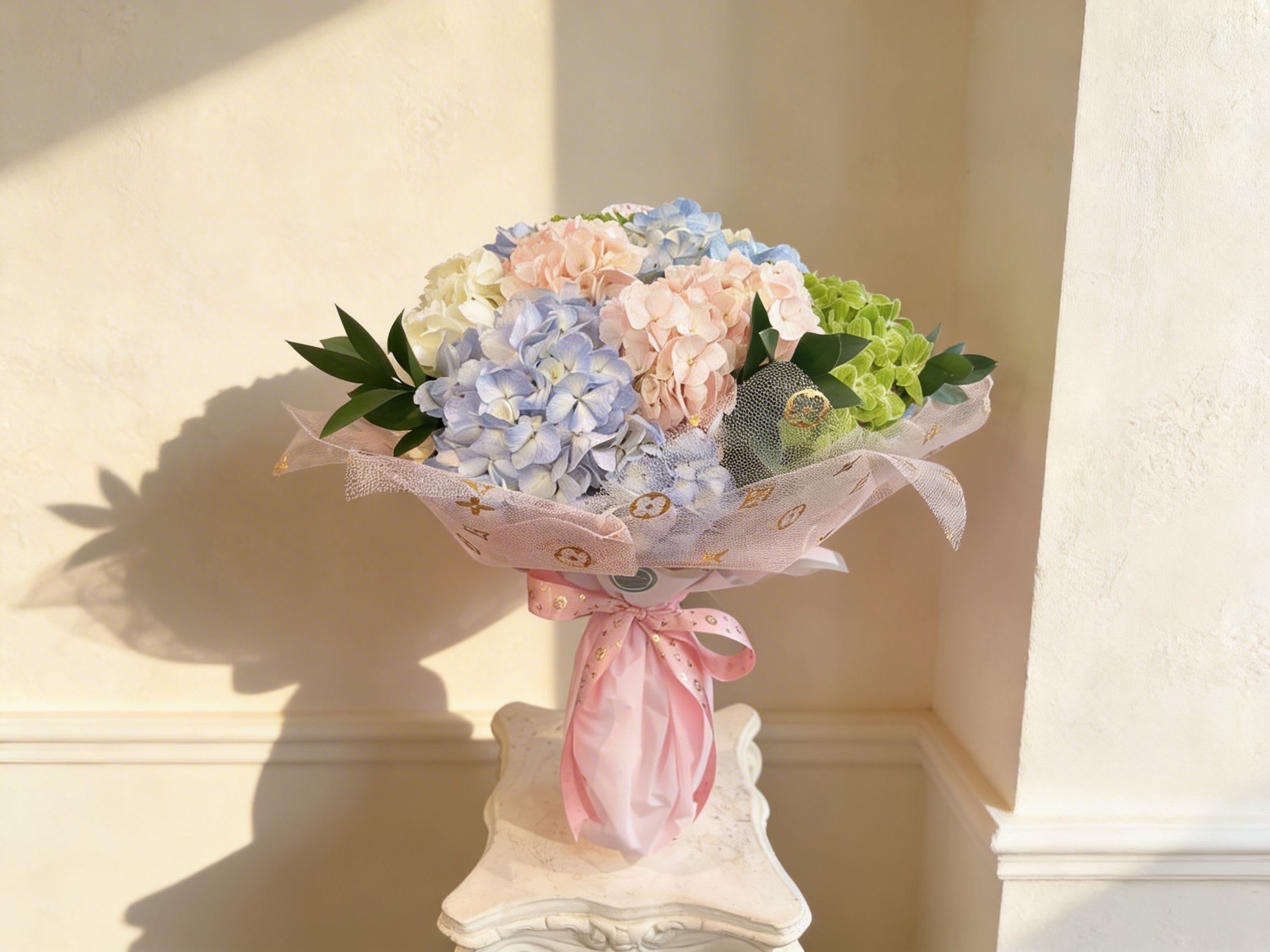 Breath of Spring  - Soft pastel hydrangeas in pink, blue, white and green, lushly wrapped with patterned paper and a pink ribbon-cheerful, gift-ready for birthdays, thank-yous, or spring celebrations. Warm reminder: in order to prolong the flower viewing time of the flowers, please put them into the vase as soon as possible when you receive the bouquet. thank you! 