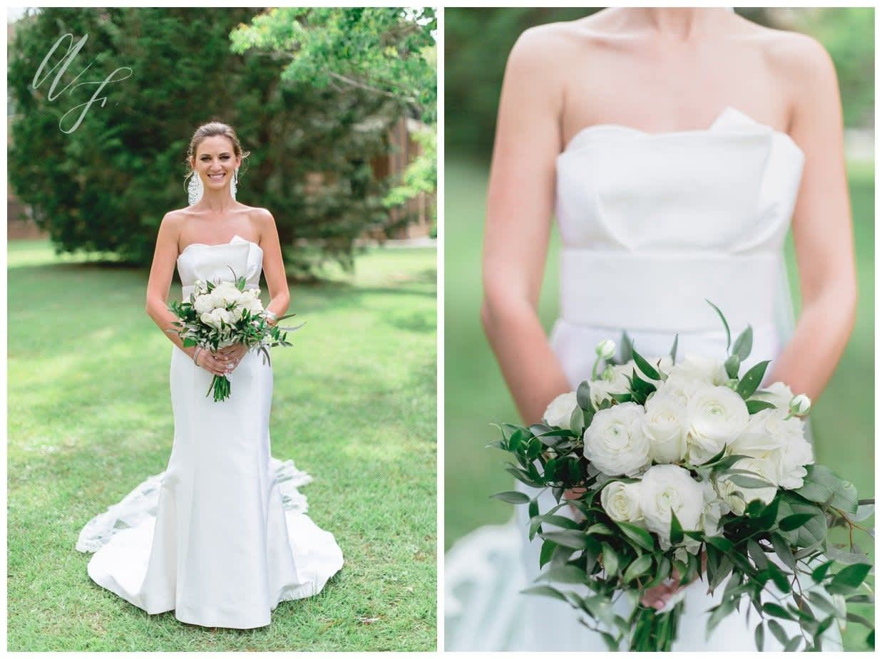 Bride holding a white rose bouquet with greenery