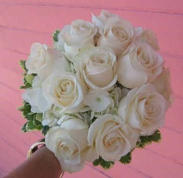 Bouquet of white roses with green accents