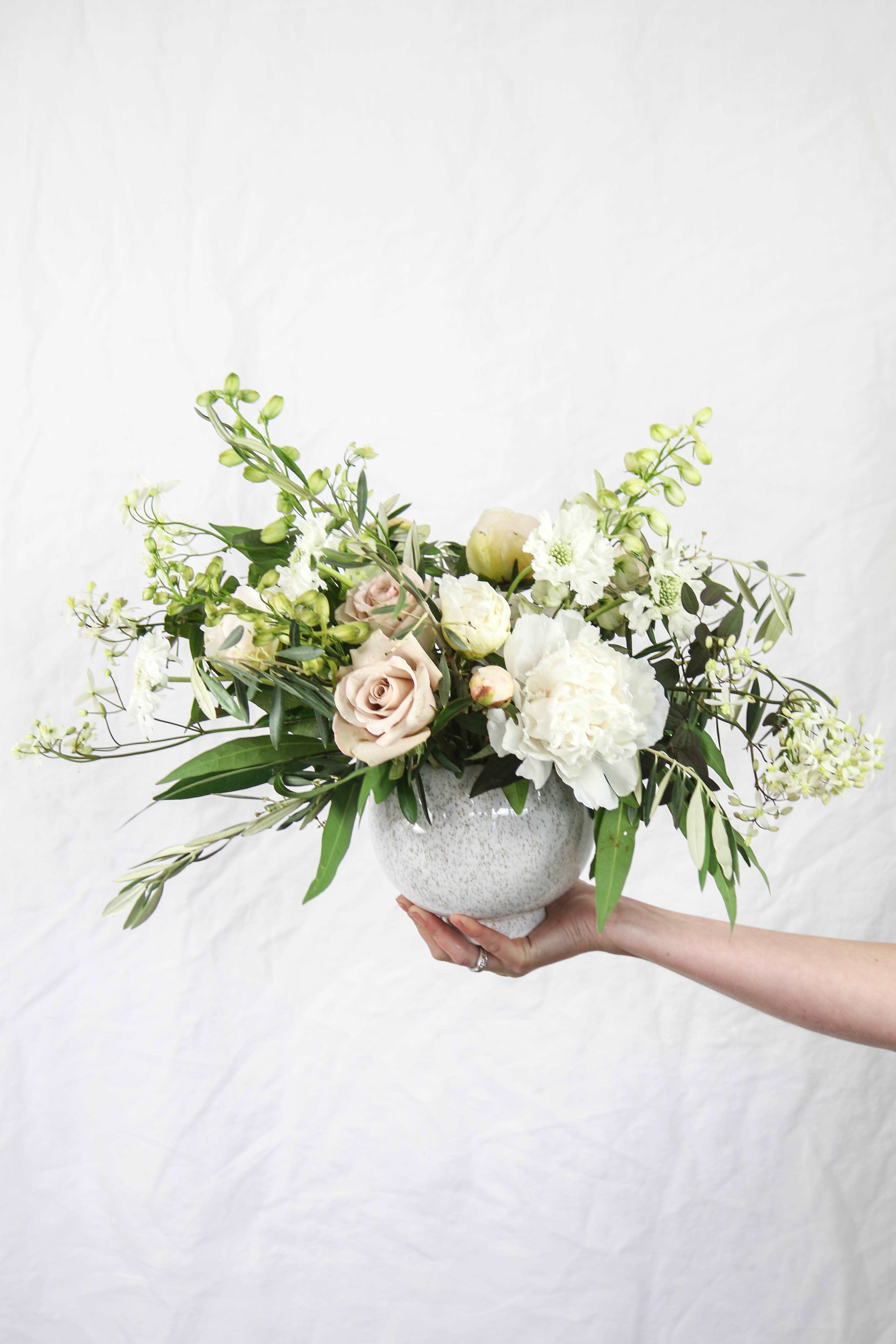 Medium Vase - We love designing with unique vases and blooms!  During the growing season, we design with the freshest flowers grown on our farm.  With over 40 varieties, you are sure to send or receive a one of kind arrangement.    Each arrangement may look slightly different from the photo shown.  