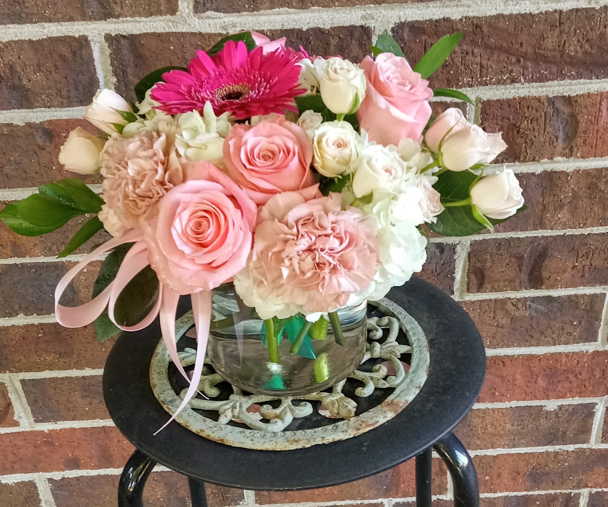 Ballet Slipper by BloomNation™ - A soft and feminine way to spread cheer! Beautiful white hydrangea, light pink roses, gerbera daisies, spray roses and delicate, pink carnations fill this cylinder vase.  Whether sending best wishes for a new baby, birthday or general cheer up, Ballet Slipper is a great gift for the pink lover in your life.  Approximate Dimensions: 10'' x 10'' 
