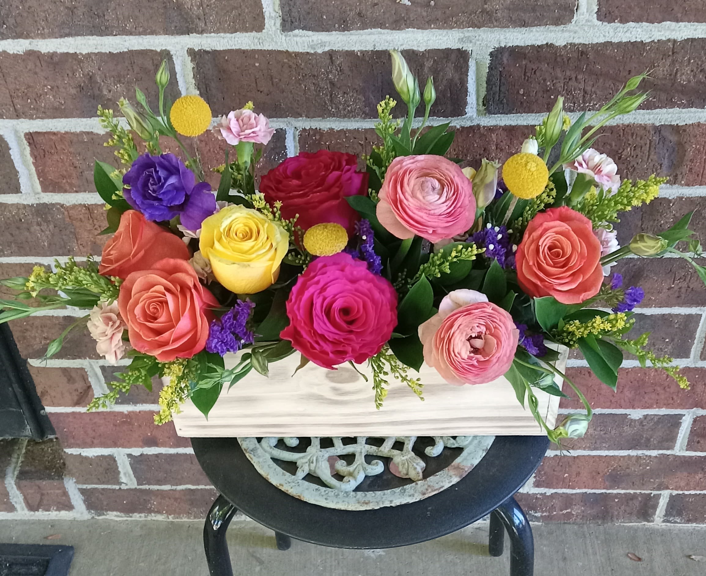 Groovy by BloomNation™ - Keep things fun with this jewel toned flower box! Ranunculus, roses, and lisianthus in a wooden garden box give this arrangement its bright colors and textures to create a beautiful centerpiece or gift.      APPROXIMATE DIMENSIONS 18" W X 10" H  