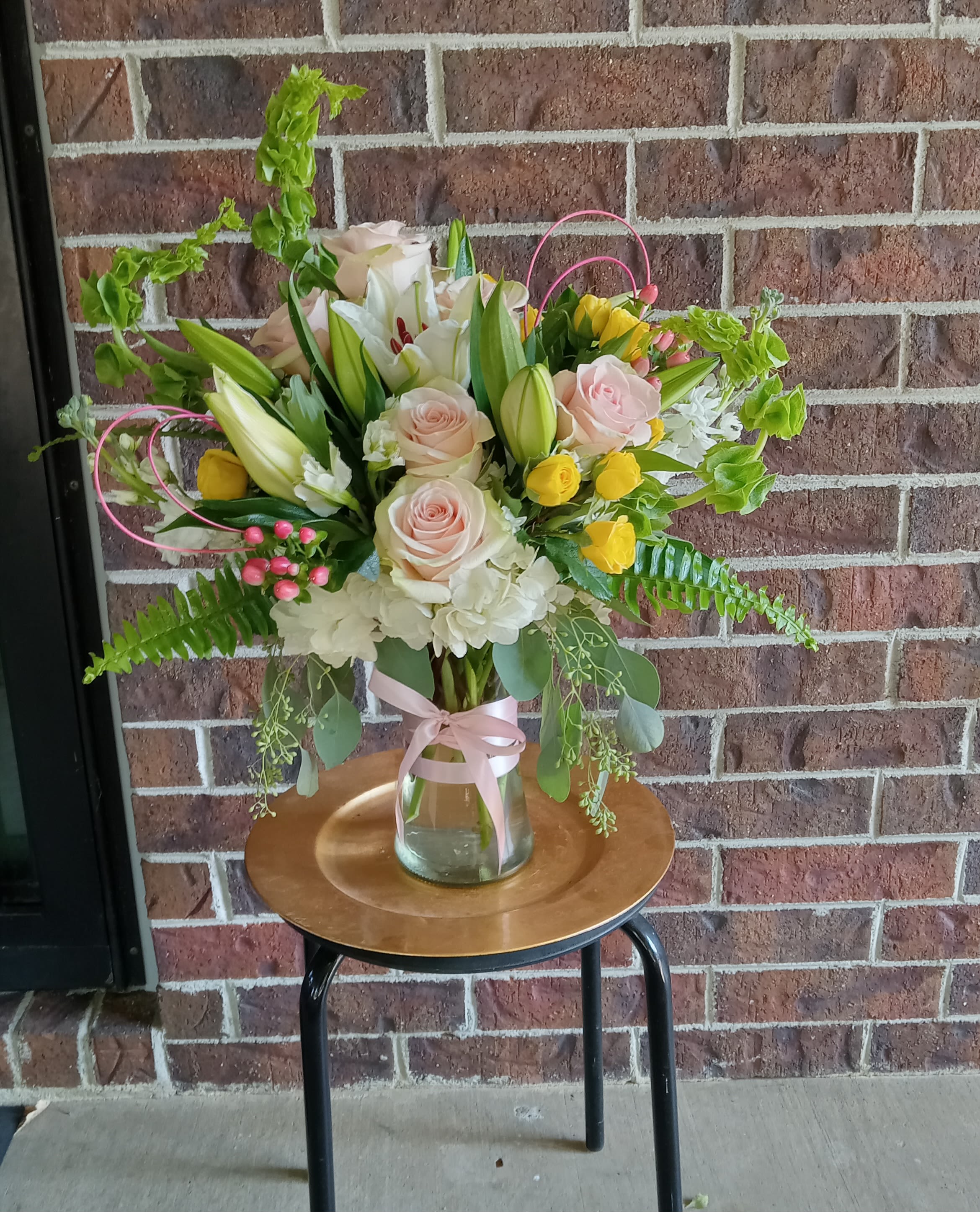 Rapunzel by BloomNation™ - This arrangement includes asiatic lilies, roses, carnations, belles of Ireland and other classic blooms. This is a great gift for a birthday, Valentine's, Mother's Day, or Just Because. APPROXIMATE DIMENSIONS: 13" D x 24" H