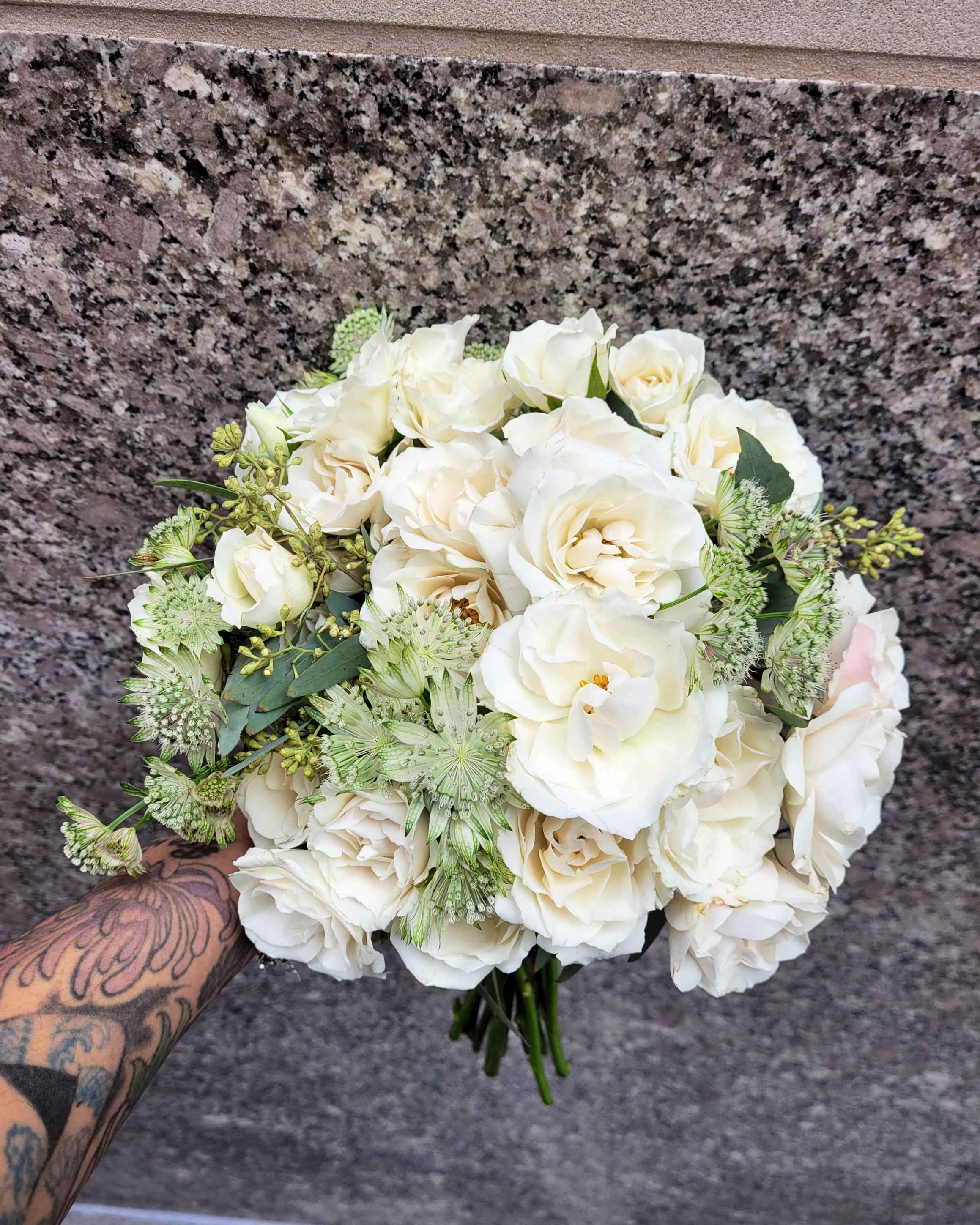 Timeless Perfection - Delicate spray roses come together in a symphony of beauty and grace. Each whispering petal exudes an air of regal sophistication, creating a mesmerizing display of floral opulence. With its cascading arrangement and exquisite blooms, this bouquet is a true testament to the allure of nature's finest treasures. Perfect for adding a touch of majestic charm to any occasion, it's an embodiment of timeless elegance and refined beauty.