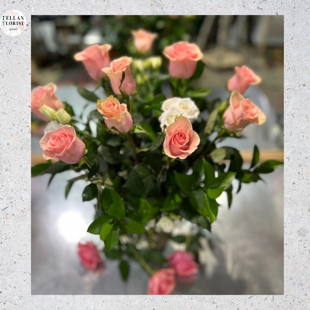 Make Me Blush - Dozen Long Stemmed Pink Roses - It's fun to be flirty! Send a dozen roses to the one you love and she just might make you blush. Especially if the dozen roses in question are this gorgeous! This arrangement is sweet and innocent as can be. Of course, it's a bit sassy and a whole lot sexy, as well.  Sending a dozen perfectly pink roses and white limonium arranged in a glass vase to the woman you love shows that you know how much fun love is! And every woman appreciates that!  Approximately 17 1/2" W x 20 1/2" H  Orientation: All-Around      As Shown : T4-1A     Deluxe : T4-1B     Premium : T4-1C  
