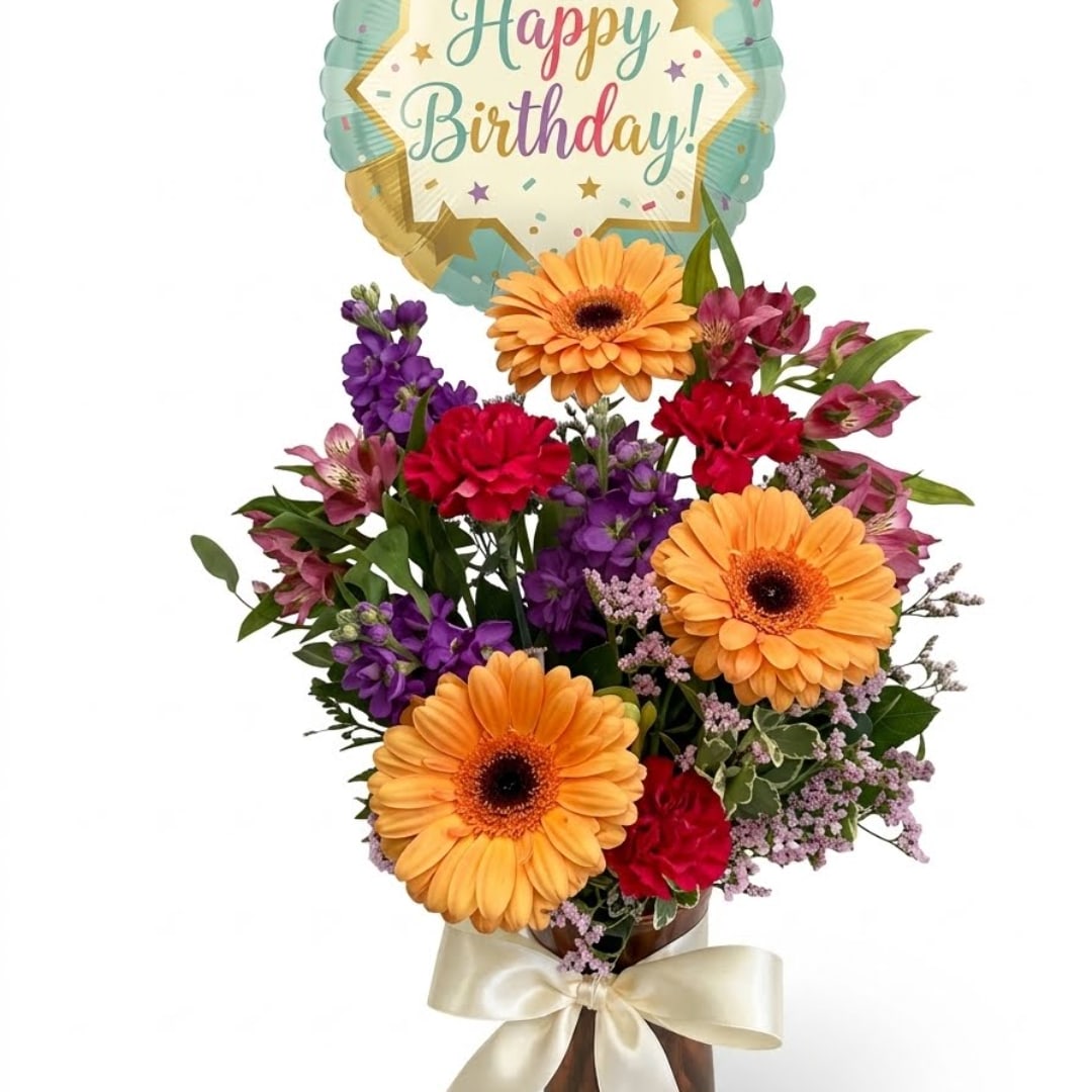 Birthday bouquet with gerbera daisies and mixed flowers, topped by a balloon