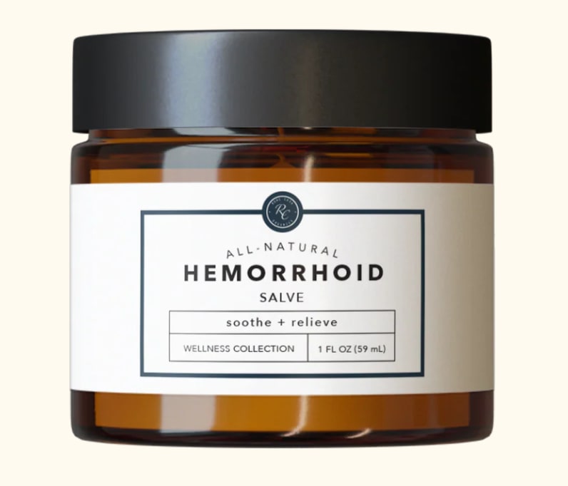 Amber jar of hemorrhoid salve with a black lid and white label