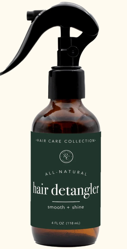 Amber spray bottle labeled hair detangler