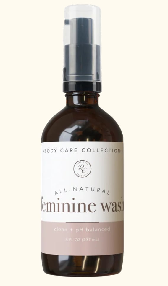 Amber pump bottle labeled feminine wash