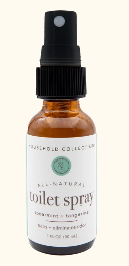 Amber spray bottle labeled toilet spray