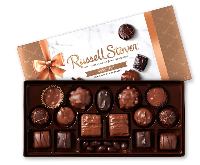 Box of assorted chocolates with a ribboned lid