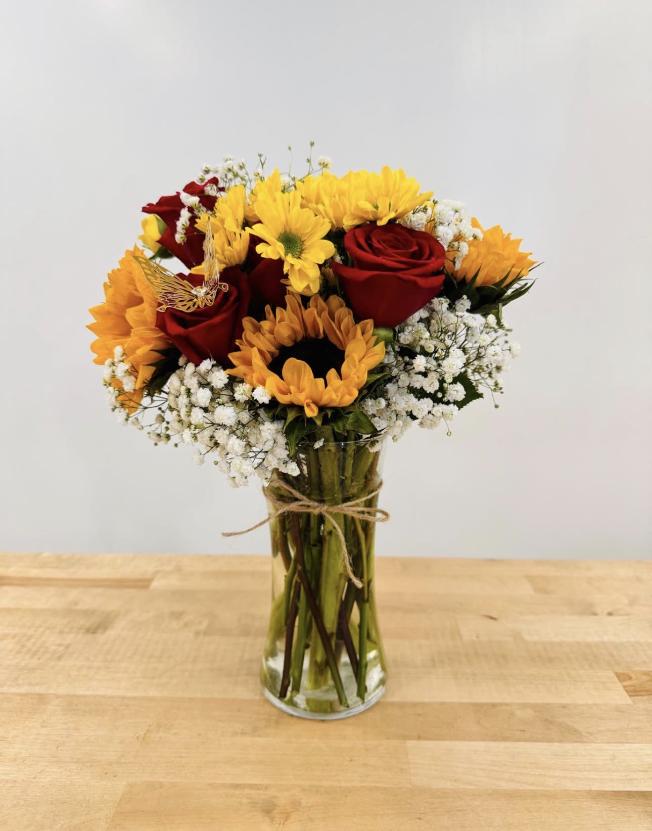 Love and Bright  - “Sunflower &amp; Rose Vase Arrangement – A cheerful mix of sunflowers, red roses, daisies, and baby’s breath in a clear vase, ready to brighten any space.”