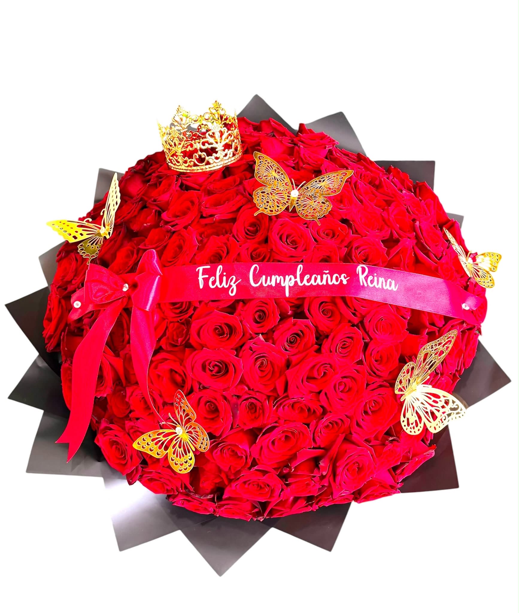 Queen - Celebrate her like the queen she is with this breathtaking luxury bouquet featuring premium red roses, an elegant gold crown, delicate butterfly accents, and a personalized satin ribbon  