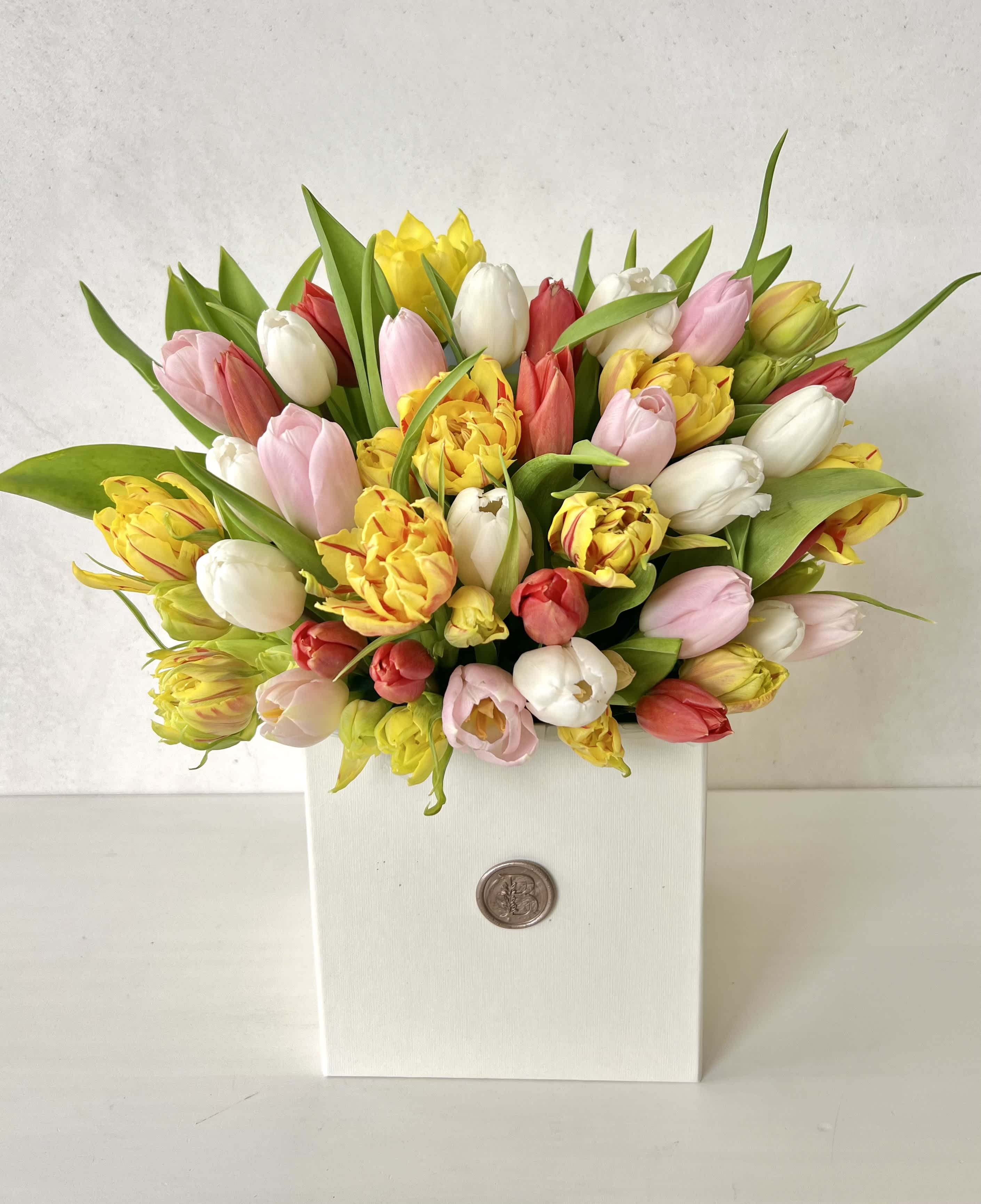 Mixed tulip bouquet in a white box
