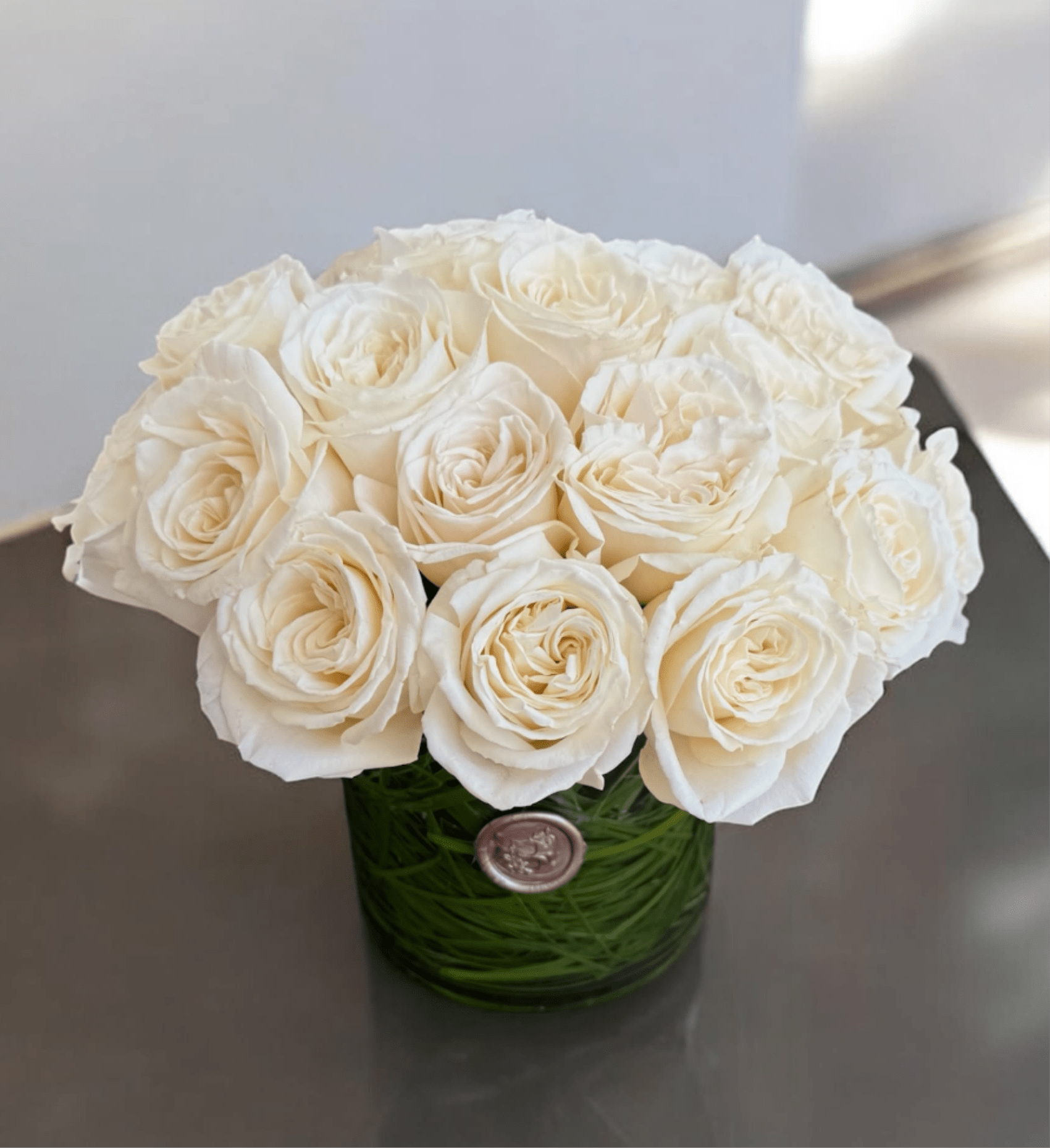 Two Dozen Roses  - Twenty-four beautiful roses arranged in a clear glass vase. A classic and thoughtful way to show love, appreciation, or celebrate a special moment.  Looking for a different color? Just leave a note for the florist at checkout, and we’ll create it in your preferred shade.