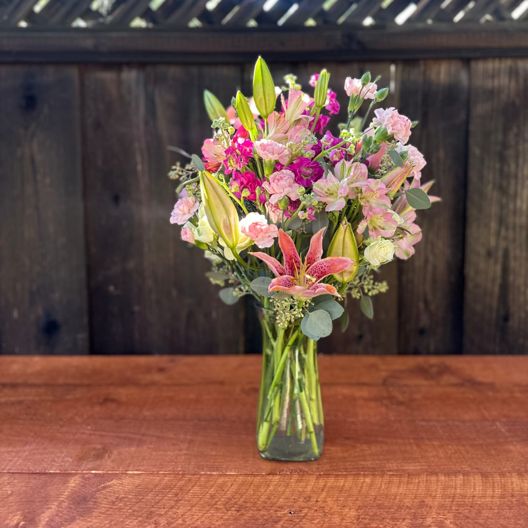 Pink and white mixed bouquet in a clear glass vase