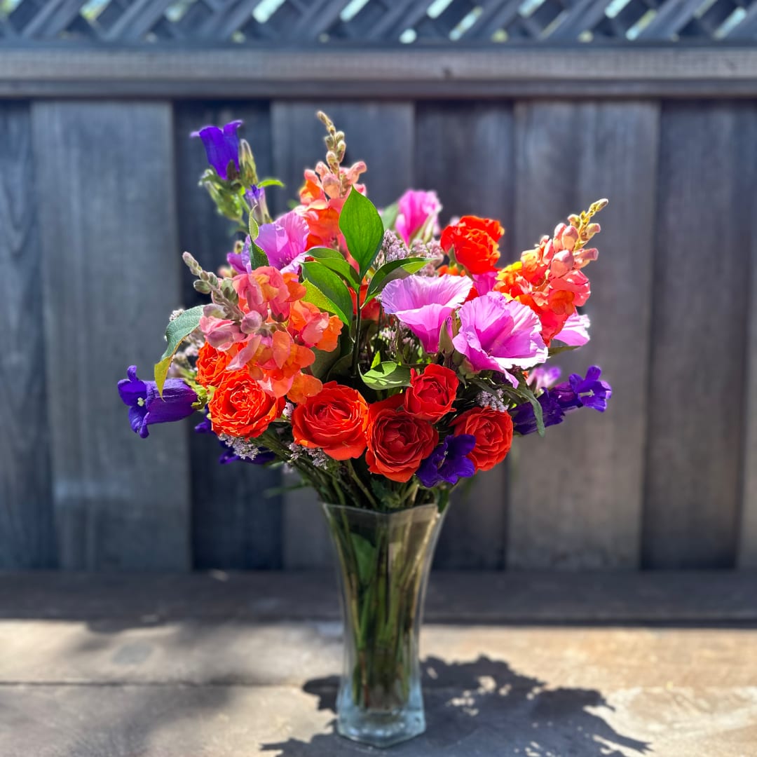 Colorful mixed bouquet in a clear glass vase