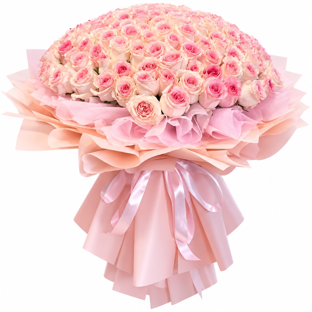 Large bouquet of pink roses wrapped in layered pink paper with ribbon