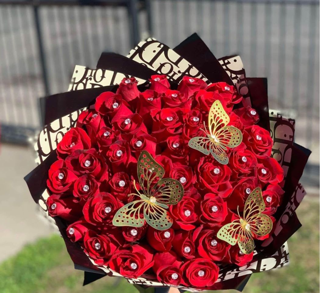 50 Roses Buchon  - 50 Premium Red Roses Wrapped and adorned with a set of butterflies. Perfect bouquet for Valentines Day, Anniversary, Birthday or any special celebration.