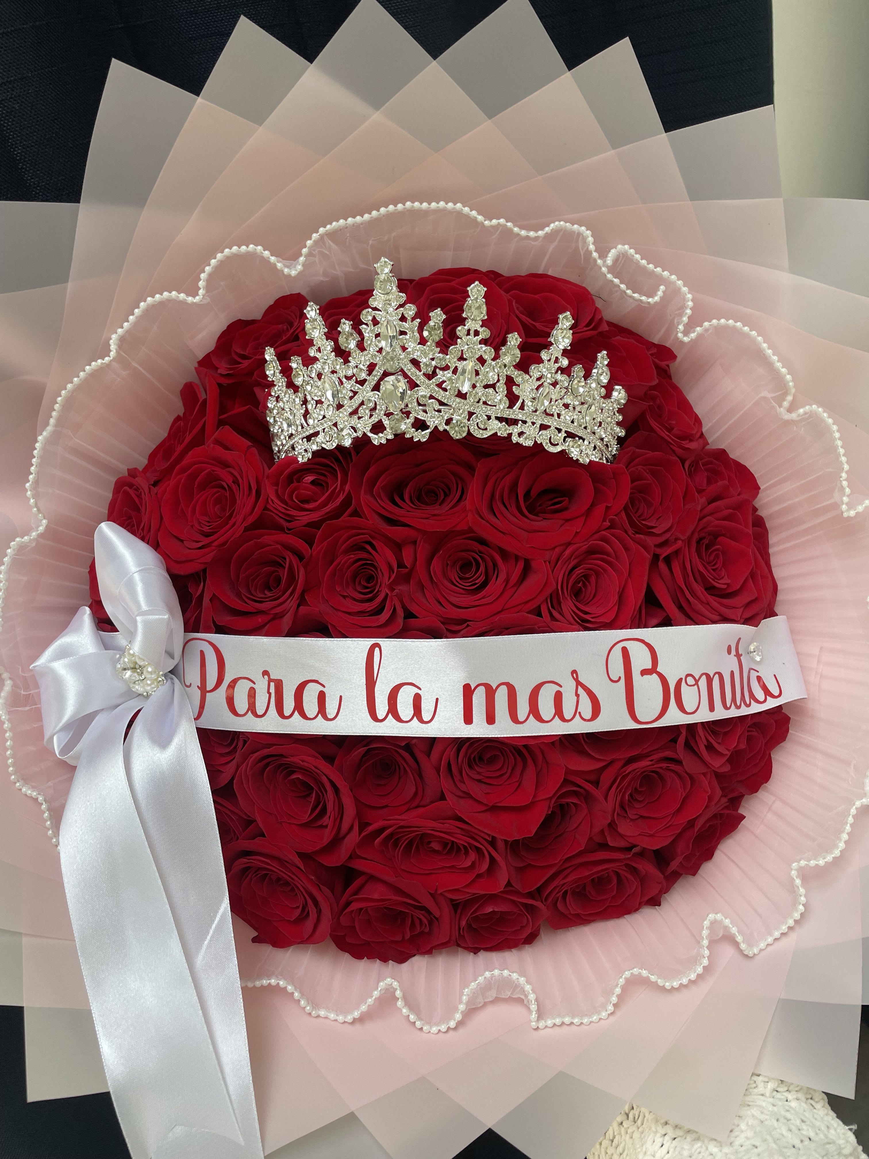 Regal Rose - 36 Roses - Make every moment unforgettable with our luxurious Roses Bouquet, hand-wrapped and styled to perfection. This elegant arrangement is designed to impress, combining the timeless beauty of roses with regal accents and a personal touch. Ideal for birthdays, anniversaries, bridal showers, proposals, or any occasion that calls for elegance and grandeur.  Personalized Ribbon — Add a name, special date, or short message (2–4 words) for a truly custom touch.  