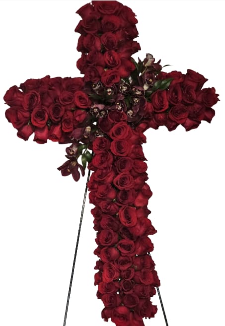Crimson Grace Cross - A striking cross adorned with deep red roses, radiating reverence and serenity. Accented with soft floral details, this arrangement conveys faith, compassion, and the beauty of eternal peace. A heartfelt expression of devotion and hope.