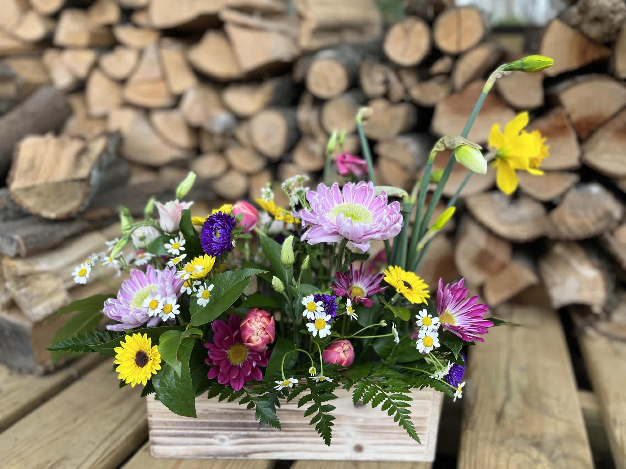 Picnic Box - Upgade a dinner party or event with a floral centerpiece!  Each centerpiece is an extravagant colorful arrangement with varying heights to create a garden feel nestled in an 8"x3" wooden box with bits of green preserved moss.   