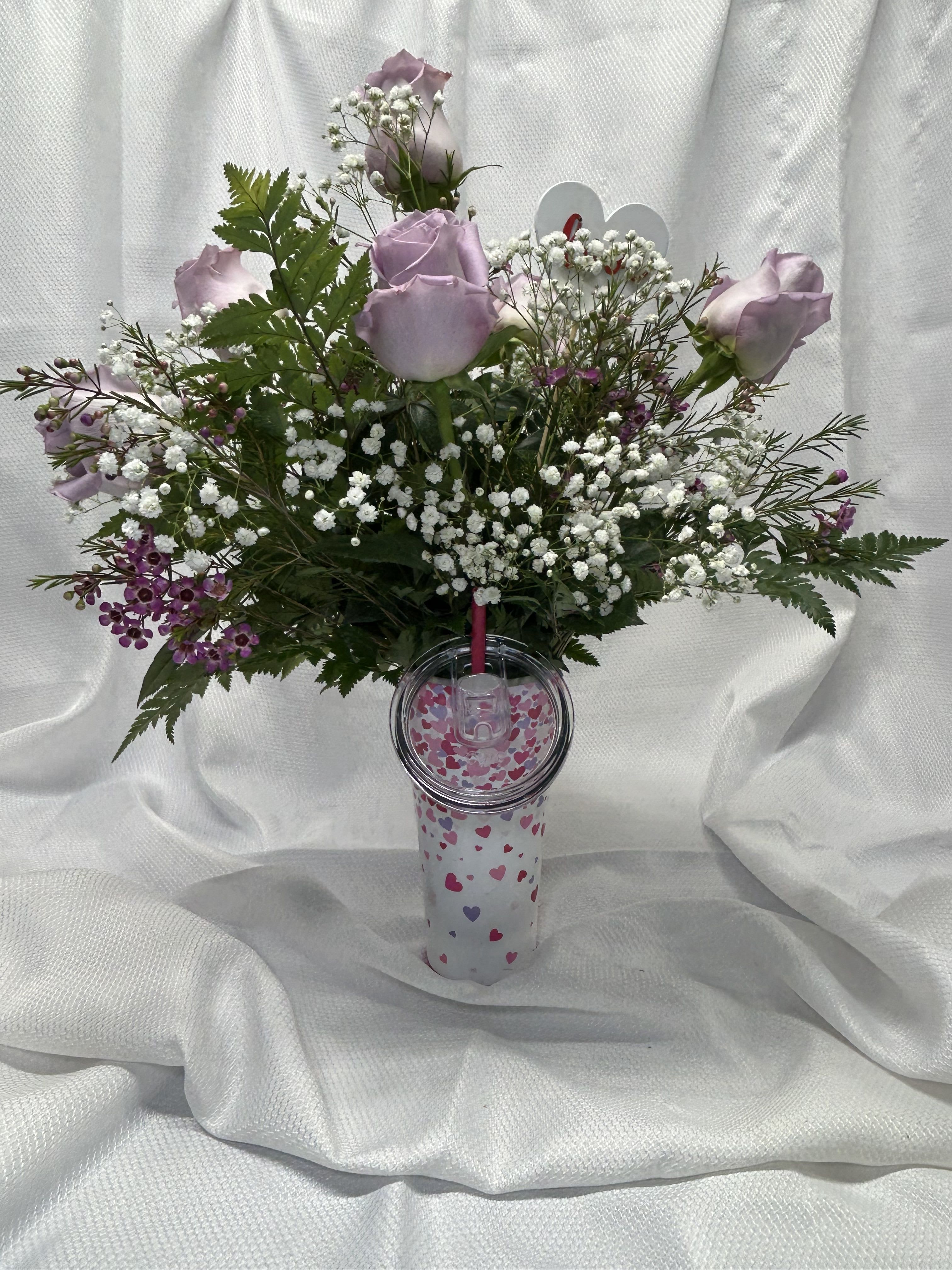 Hearts a Flutter - 6 roses with babies breath and wax flower in a swig cup. Cups are dishwasher safe. Lavender roses shown, please specify color: red, white, pink, hot pink, yellow, lavender or mixed red, white, &amp; pink.