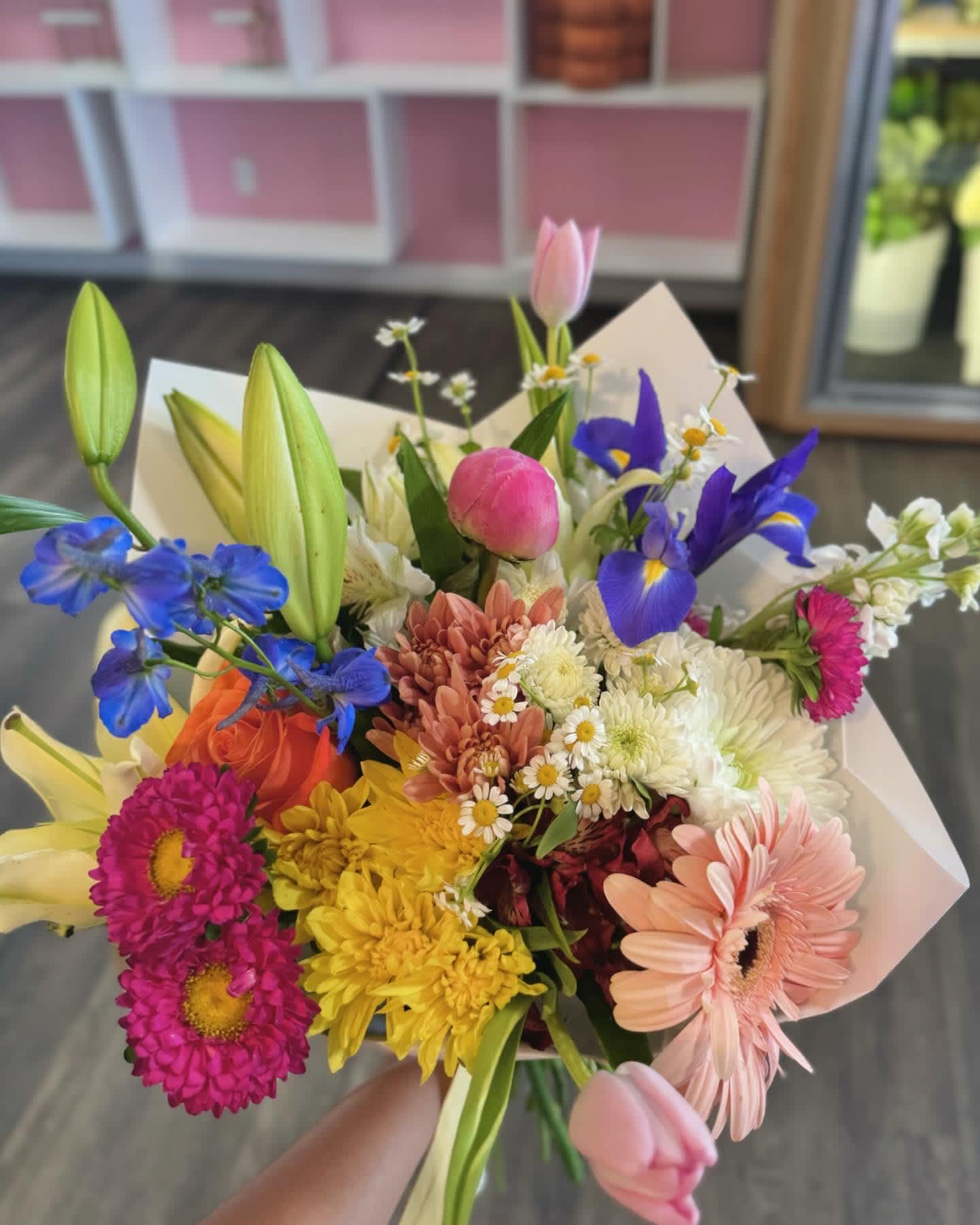 Colorful mixed bouquet with lilies, tulips, daisies, and gerbera daisies
