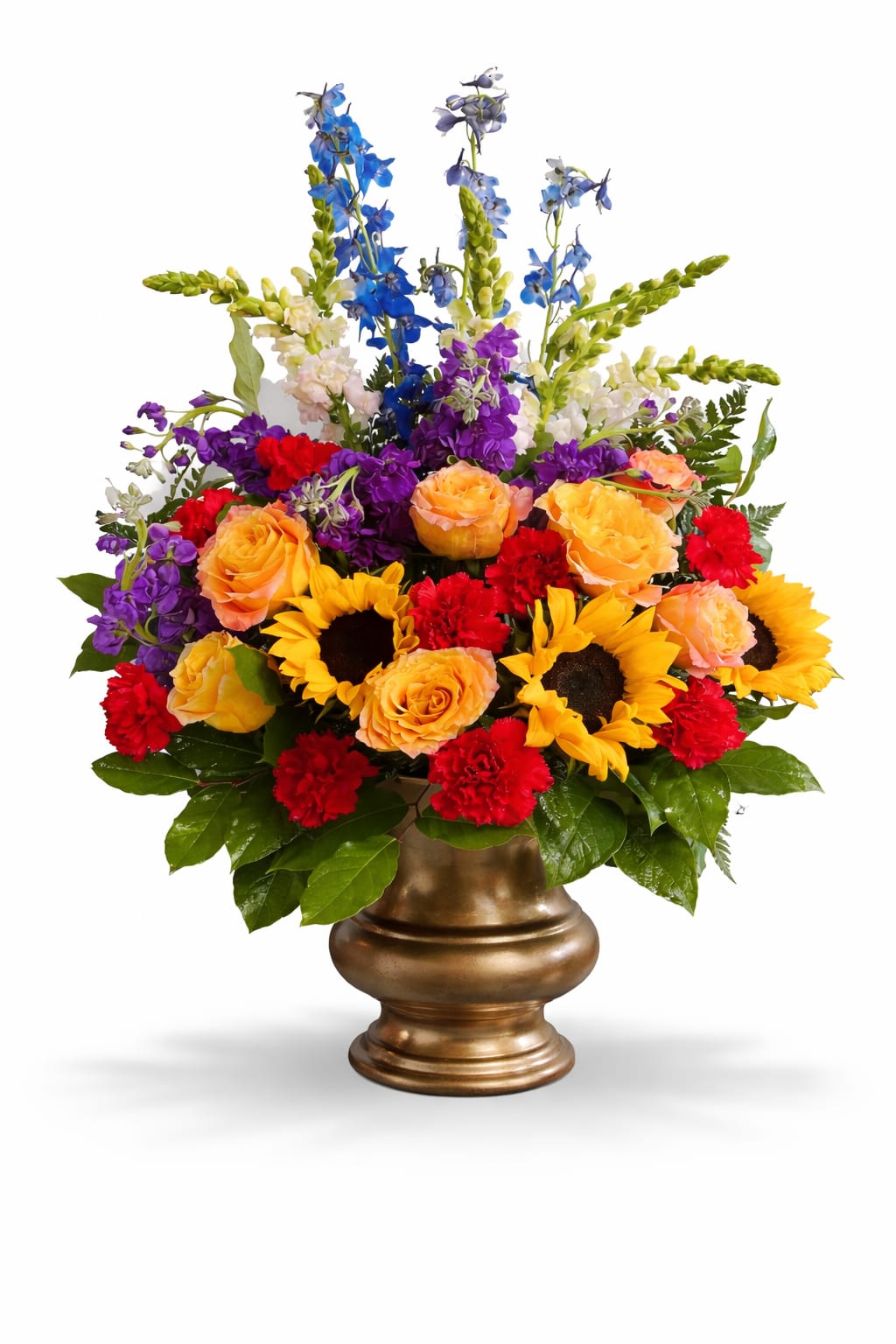 Colorful mixed flower arrangement in a gold vase