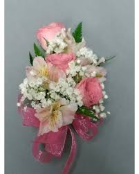 Pink and white floral corsage with ribbon