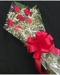 Bouquet of red roses with baby's breath and a red ribbon