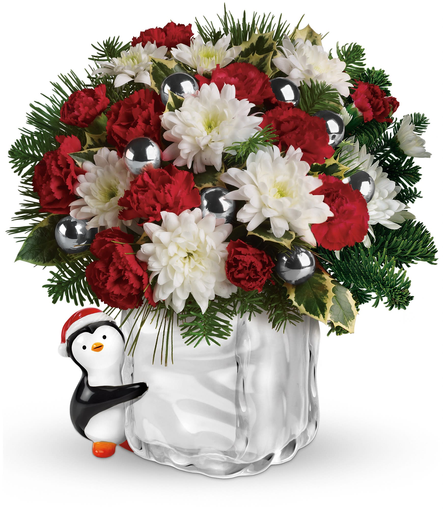Teleflora's Send a Hug Penguin Bouquet - The sweet holiday flower arrangement includes red miniature carnations, white cushion spray chrysanthemums, variegated holly, white pine and noble fir. Approximately 10 1/2" W x 11 1/2" H.  T11X500A