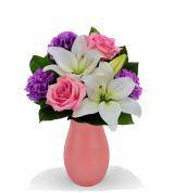 Pink and white flower bouquet in a pink vase