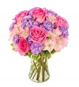 Pink and lavender bouquet in a clear glass vase
