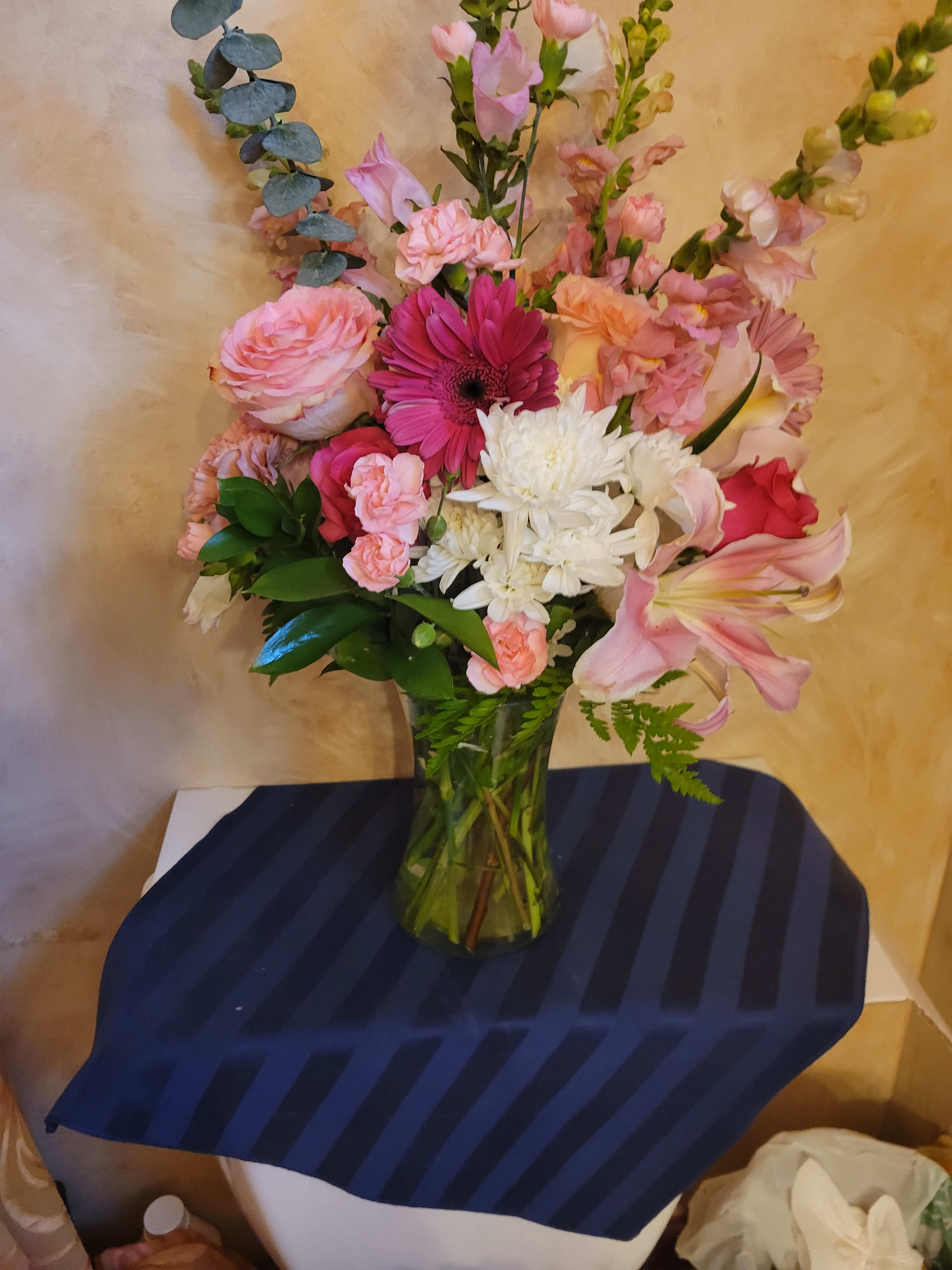 Pink and white mixed bouquet in a clear glass vase