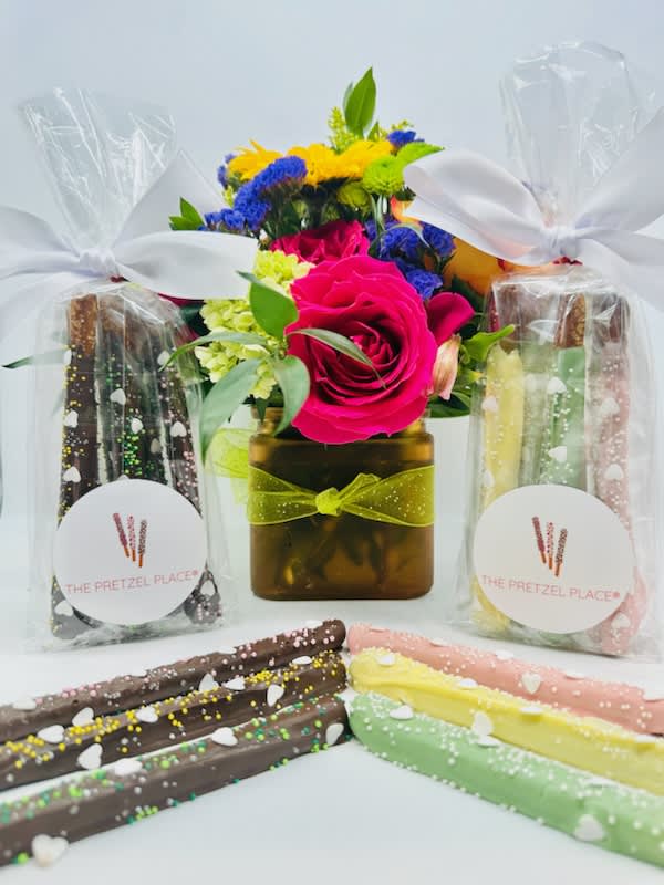 Flower arrangement with pretzel gift bags and chocolate-covered pretzel rods