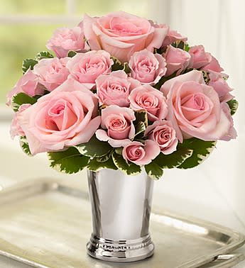 Julep Cup Bouquet - Product ID: 105243  EXCLUSIVE Add bright smiles to their day with this sparkling surprise! A handcrafted bouquet of fresh roses and petite-bloomed spray rosesâin your choice of sunny yellow or pretty pinkâis gathered with love by our expert florists inside a shimmering julep cup vase, creating the perfect mix of classic and contemporary. Compact arrangement of roses and spray roses, accented with variegated pittosporum Available with yellow or pink roses and spray roses Artistically designed in a keepsake julep cup vase; measures 4.5"H Each arrangement measures approximately 7"H x 7"L Our florists select the freshest flowers available so floral colors and varieties may vary